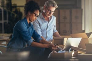 Man and woman packing boxes